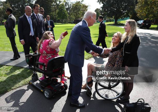 President Joe Biden greets members of the disabled community and advocates following an event honoring the Americans with Disabilities Act and...