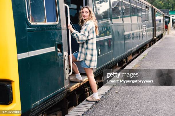 young commuter boarding a train - britain in the 90s stockfoto's en -beelden