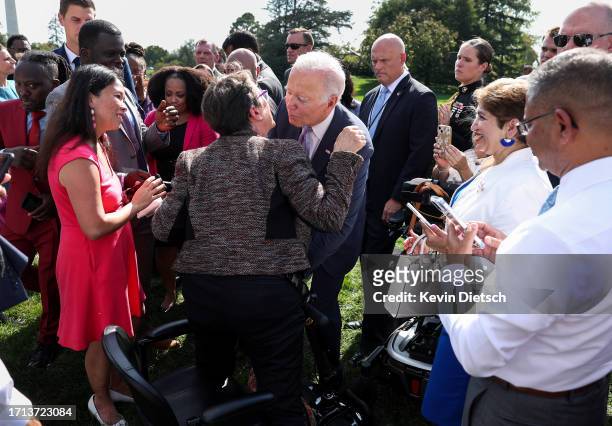 President Joe Biden greets advocates and members of the disabled community following an event honoring the Americans with Disabilities Act and...