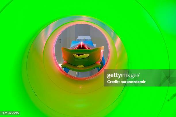 man receiving a medical scan, rear view - radiotherapy stock pictures, royalty-free photos & images