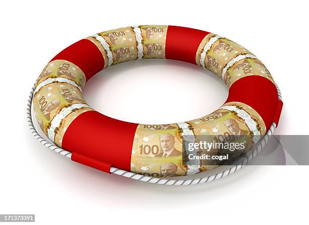 life preserver covered by canadian dollars - canadian one hundred dollar bill 個照片及圖片檔