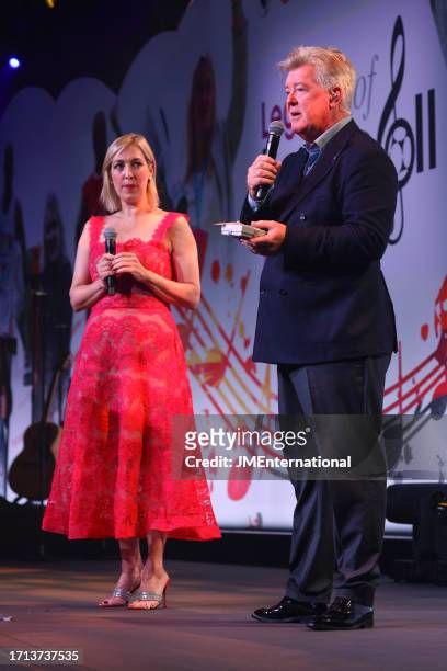 Kelly Cates and Geoff Shreeves on stage at the Legends of Football 2023 event at Grosvenor House on October 02, 2023 in London, England.