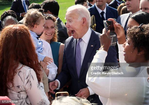 President Joe Biden greets advocates and members of the disabled community following an event honoring the Americans with Disabilities Act and...