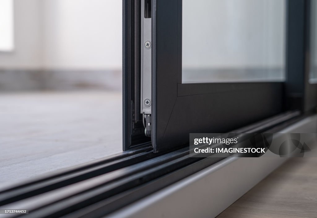 Close-up of an anthracite gray aluminum window with glass in a new house