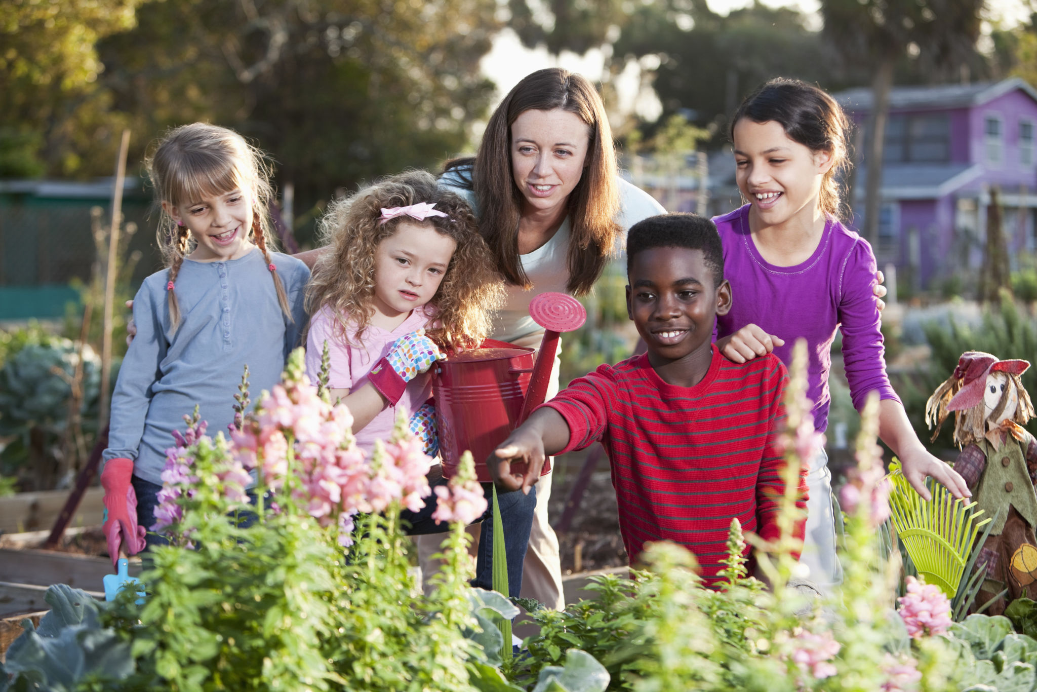 Woman and children at community garden Woman and children at community garden