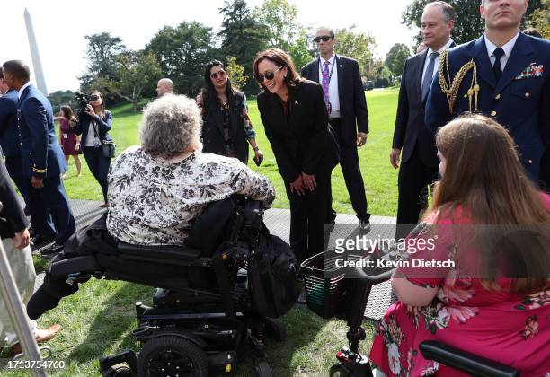 Vice President Kamala Harris greets advocates and members of the disabled community following an event honoring the Americans with Disabilities Act...