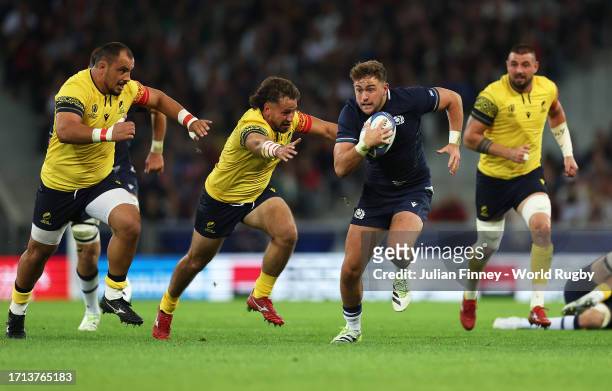 Ollie Smith of Scotland evades the Romania defence during the Rugby World Cup France 2023 match between Scotland and Romania at Stade Pierre Mauroy...