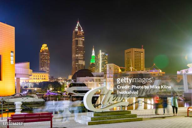 evening in voinovich park - cleveland ohio - cleveland ohio sign stock pictures, royalty-free photos & images