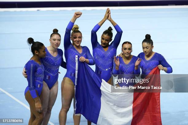 France's Team celebrate the qualification during the Women's Qualifications on Day Three of the 2023 Artistic Gymnastics World Championships on...