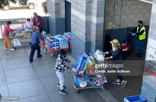 Customers leave a Costco store on October 02, 2023 in San Francisco, California. According to a report by the Commerce Department, U.S. Consumer...