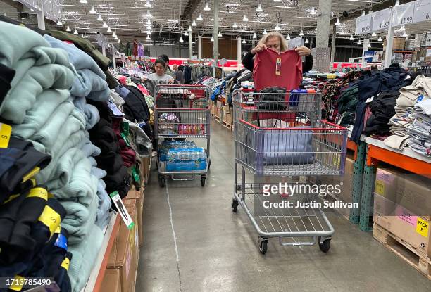 Customers shop for clothing at a Costco store on October 02, 2023 in San Francisco, California. According to a report by the Commerce Department,...