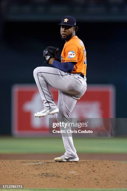 Cristian Javier of the Houston Astros throws a warm up pitch between innings during the game against the Arizona Diamondbacks at Chase Field on...