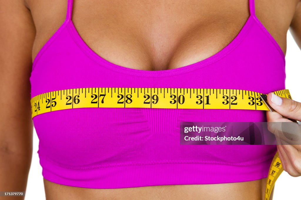 Woman measuring her bust