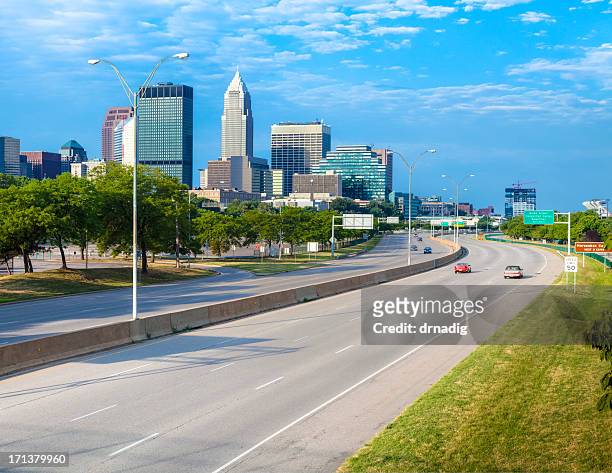 cleveland skyline over interstate 90 - cleveland ohio stock pictures, royalty-free photos & images