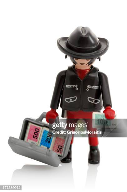 playmobil with money briefcase - playmobil stock pictures, royalty-free photos & images