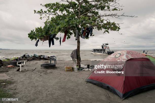 Migrants camp on the beach in Turbo, Antioquia department, Colombia, on Sunday, Oct. 8, 2023. The number of migrants trying to reach the US border by...
