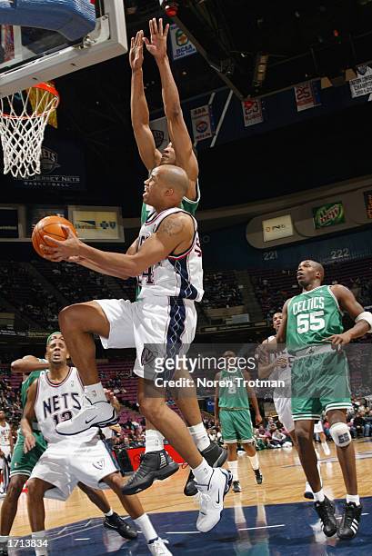 Richard Jefferson of the New Jersey Nets drives to the basket during the NBA game against the Boston Celtics at Continental Airlines Arena on...