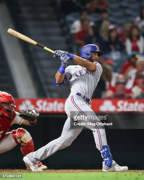 Leody Taveras of the Texas Rangers singles in the eighth inning against the Los Angeles Angels at Angel Stadium of Anaheim on September 25, 2023 in...