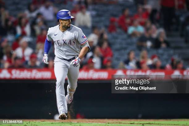 Marcus Semien of the Texas Rangers watches his hit in the eighth inning against the Los Angeles Angels at Angel Stadium of Anaheim on September 25,...