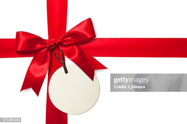 red gift bow with tag - gift ribbon stockfoto's en -beelden