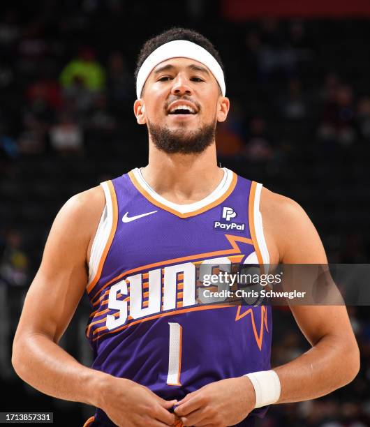 Devin Booker of the Phoenix Suns smiles during the game against the Detroit Pistons on October 8, 2023 at Little Caesars Arena in Detroit, Michigan....