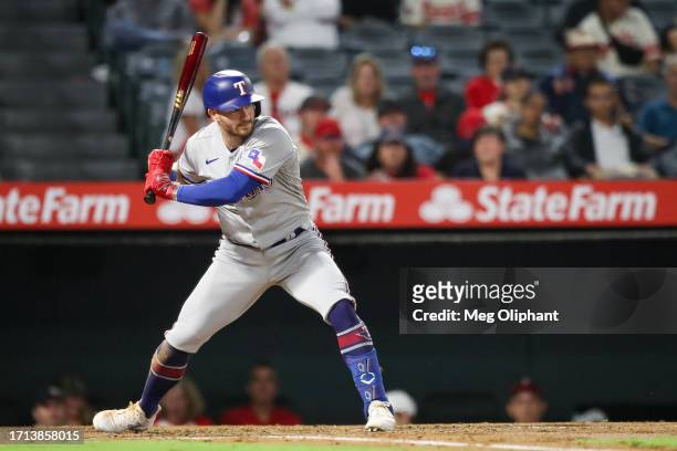 Robbie Grossman of the Texas Rangers bats in the third inning against the Los Angeles Angels at Angel Stadium of Anaheim on September 25, 2023 in...