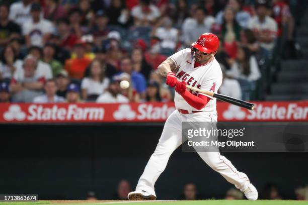 Mike Moustakas of the Los Angeles Angels bats in the first inning against the Texas Rangers at Angel Stadium of Anaheim on September 25, 2023 in...
