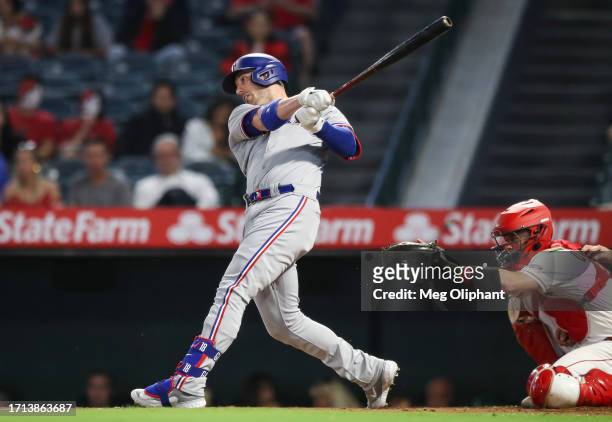 Mitch Garver of the Texas Rangers singles in the second inning against the Los Angeles Angels at Angel Stadium of Anaheim on September 25, 2023 in...