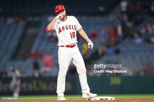 Nolan Schanuel of the Los Angeles Angels reacts after hitting a double in the first inning against the Texas Rangers at Angel Stadium of Anaheim on...