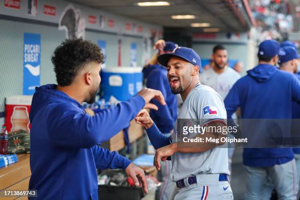 Marcus Semien of the Texas Rangers interacts with teammates in the dugout before the game against the Los Angeles Angels at Angel Stadium of Anaheim...