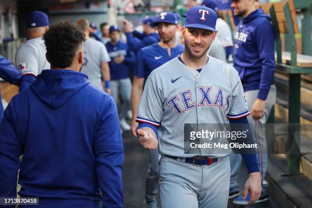 Mitch Garver of the Texas Rangers interacts with teammates in the dugout before the game against the Los Angeles Angels at Angel Stadium of Anaheim...