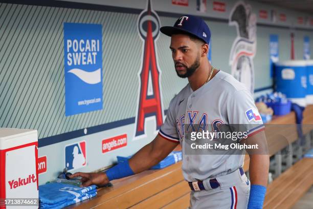 Leody Taveras of the Texas Rangers looks on in the dugout before the game against the Los Angeles Angels at Angel Stadium of Anaheim on September 25,...