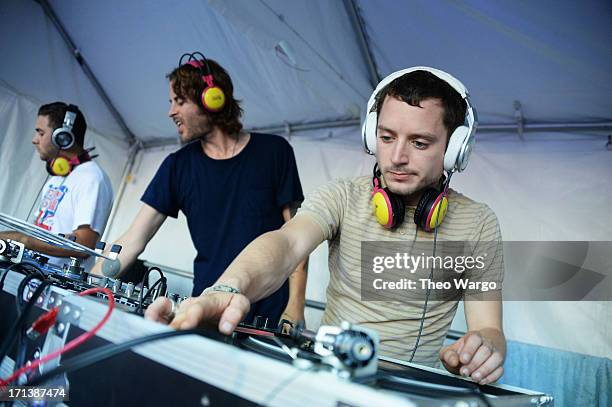 Zach Cowie and Elijah Wood spin onstage at the Firefly Music Festival at The Woodlands of Dover International Speedway on June 23, 2013 in Dover,...