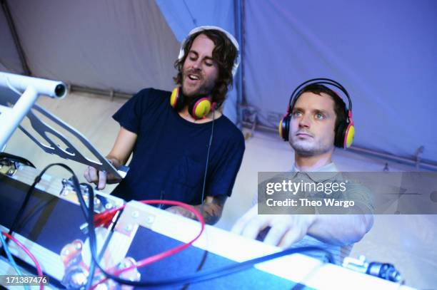 Zach Cowie and Elijah Wood spin onstage at the Firefly Music Festival at The Woodlands of Dover International Speedway on June 23, 2013 in Dover,...