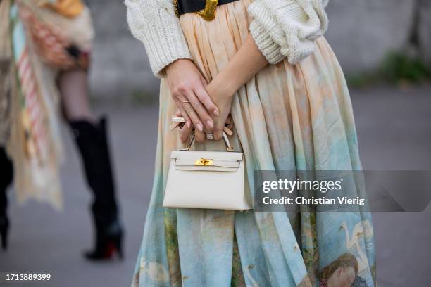Nadine Leopold wears knit skirt with print, Hermes bag outside Zimmermann during the Womenswear Spring/Summer 2024 as part of Paris Fashion Week on...