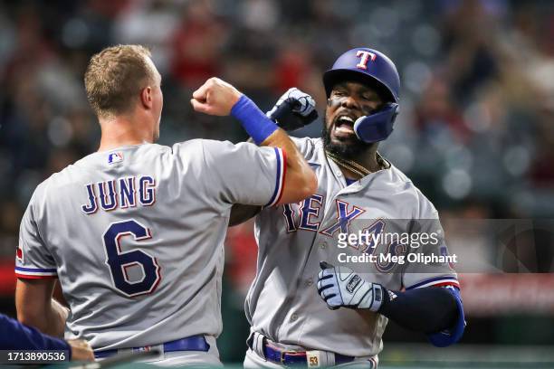 Adolis Garcia of the Texas Rangers celebrates his home run with Josh Jung in the sixth inning against the Los Angeles Angels at Angel Stadium of...