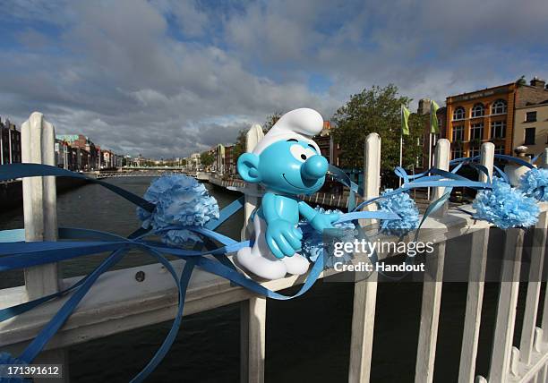 In this handout image provided by Sony Pictures Entertainment, The Ha'penny Bridge was festooned with blue flowers and hundreds of miniature smurfs...