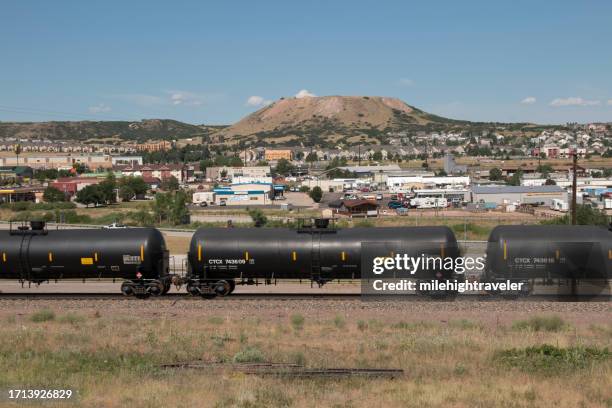 train tank cars roll through castle rock colorado railroad - castle rock colorado stock pictures, royalty-free photos & images