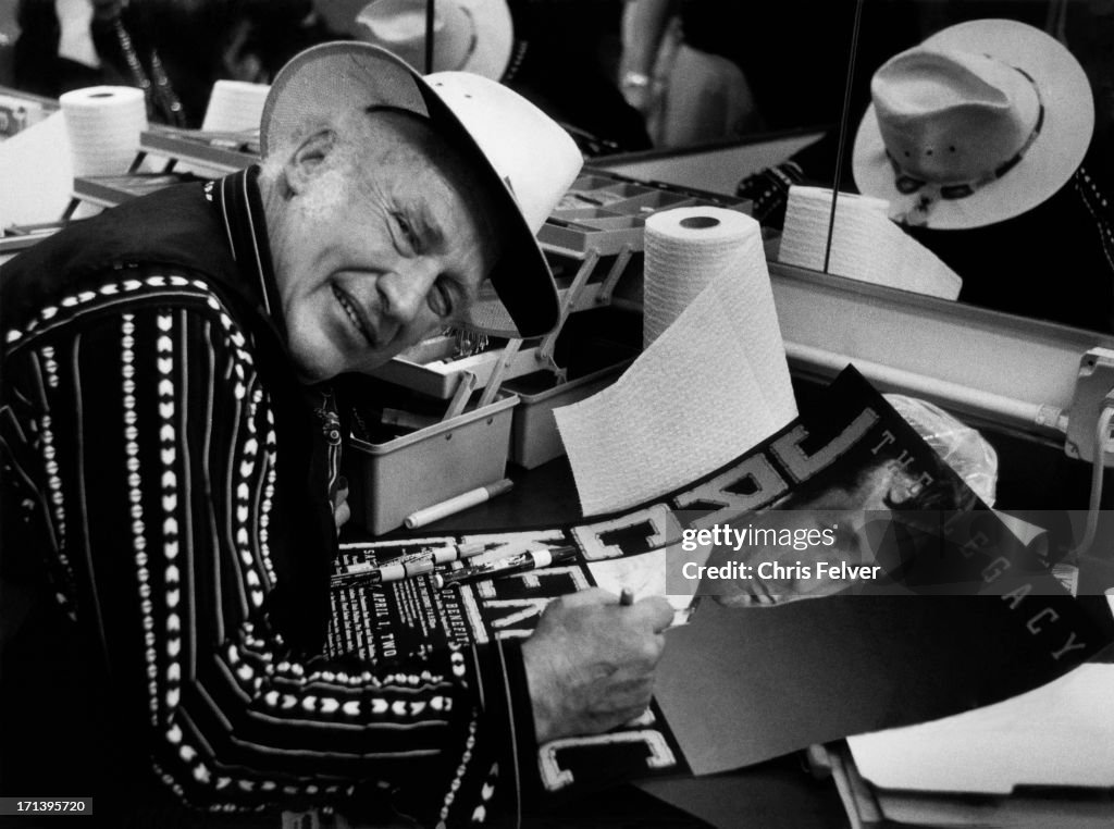Ken Kesey Signing A Poster
