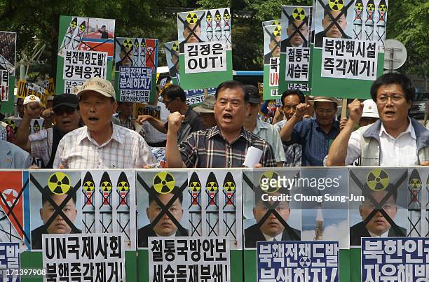 South Korean conservative protesters shout their slogans during an anti-North Korea rally to mark 63rd anniversary of the Korean war on June 24, 2013...