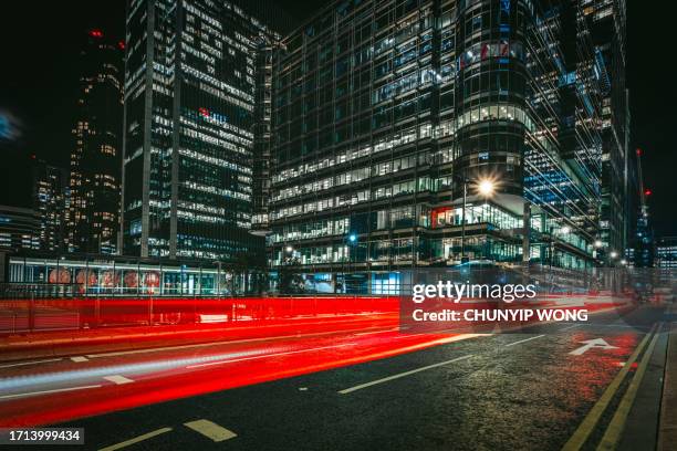 canary wharf financial district at night - rear light car stock pictures, royalty-free photos & images