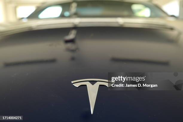 Model Y car sits inside a home garage whilst receiving a top up charge of solar powered electricity on October 03, 2023 in Ballina, Australia.