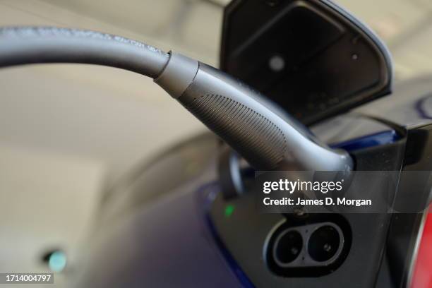 Model Y car sits inside a home garage whilst receiving a top up charge of solar powered electricity on October 03, 2023 in Ballina, Australia.