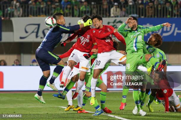 Shinzo Koroki of Urawa Red Diamonds heads to score his team's first goal during the J.League J1 first stage match between Shonan Bellmare and Urawa...