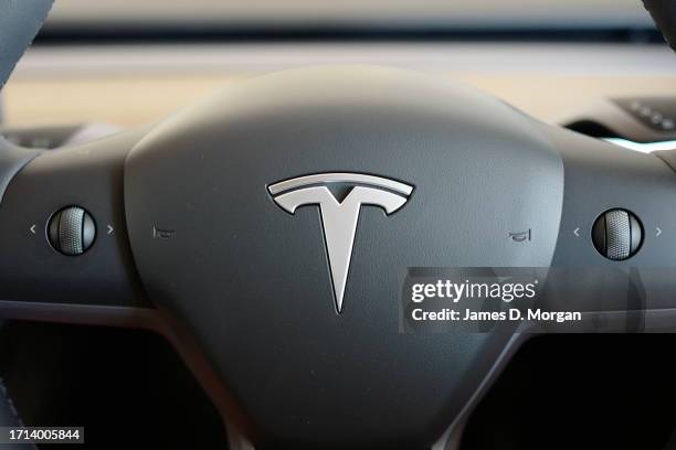 Model Y car sits inside a home garage whilst receiving a top up charge of solar powered electricity on October 03, 2023 in Ballina, Australia.