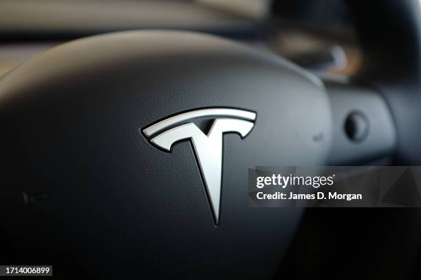 Model Y car sits inside a home garage whilst receiving a top up charge of solar powered electricity on October 03, 2023 in Ballina, Australia.