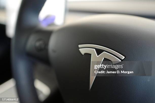 Model Y car sits inside a home garage whilst receiving a top up charge of solar powered electricity on October 03, 2023 in Ballina, Australia.