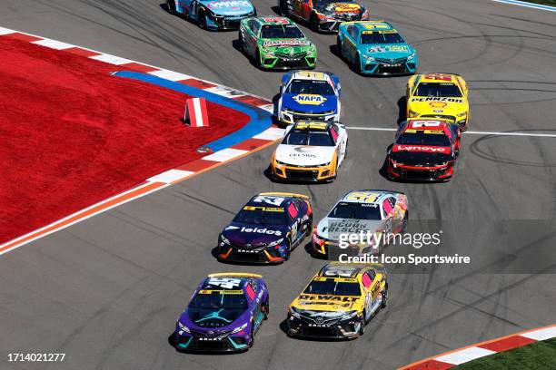 Tyler Reddick and Christopher Bell (#20 Joe Gibbs Racing DEWALT Plumbing Solutions lead the field to the green flag during the running of the NASCAR...