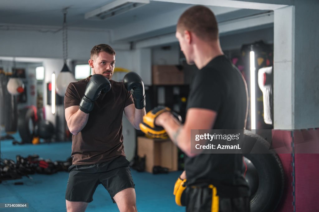 Practising Boxing Caucasian Male Practicing New Boxing Sequences In A Gym High-Res Stock ...