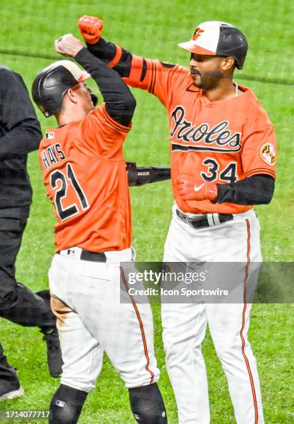 October 08: Baltimore Orioles right fielder Aaron Hicks celebrates his home run with left fielder Austin Hays during the Texas Rangers versus the...